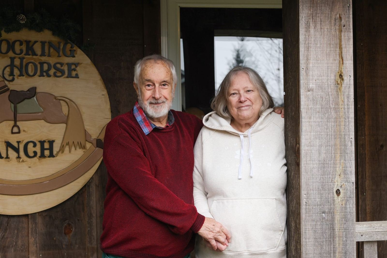 The ranch doorway — couple in a rustic doorway